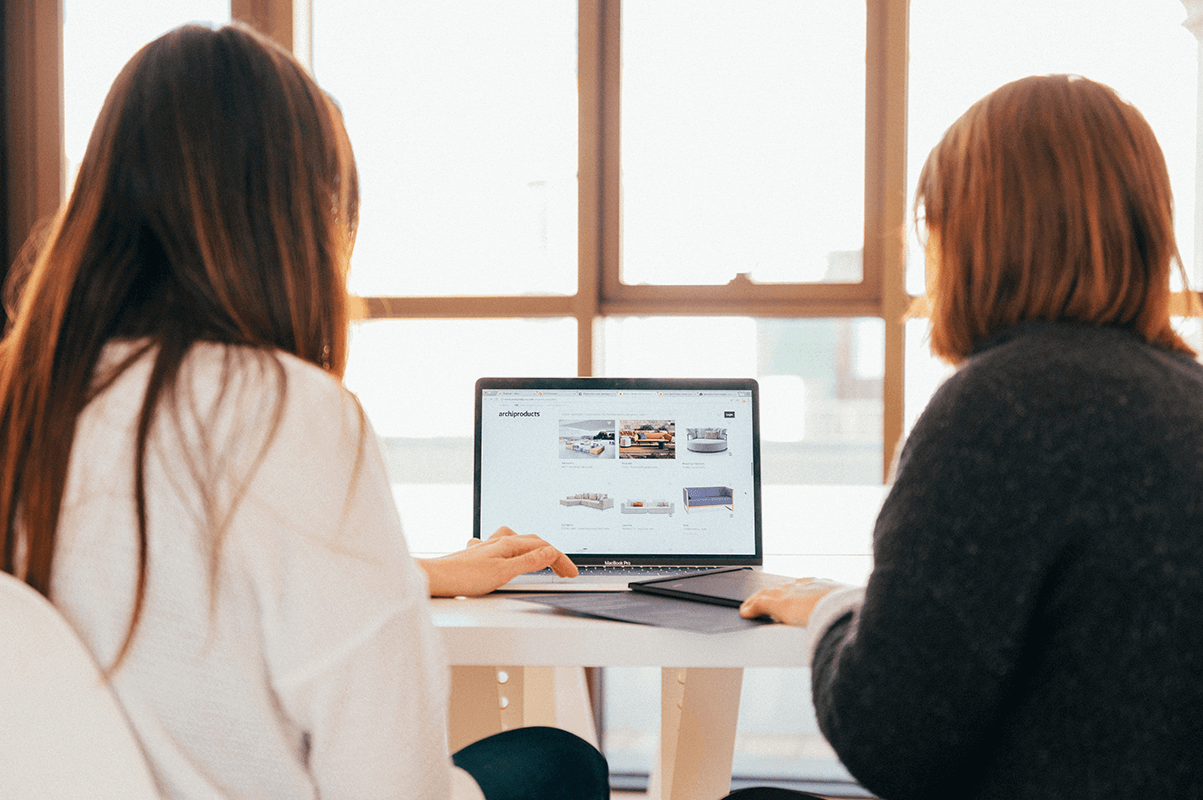 women in business looking at a laptop